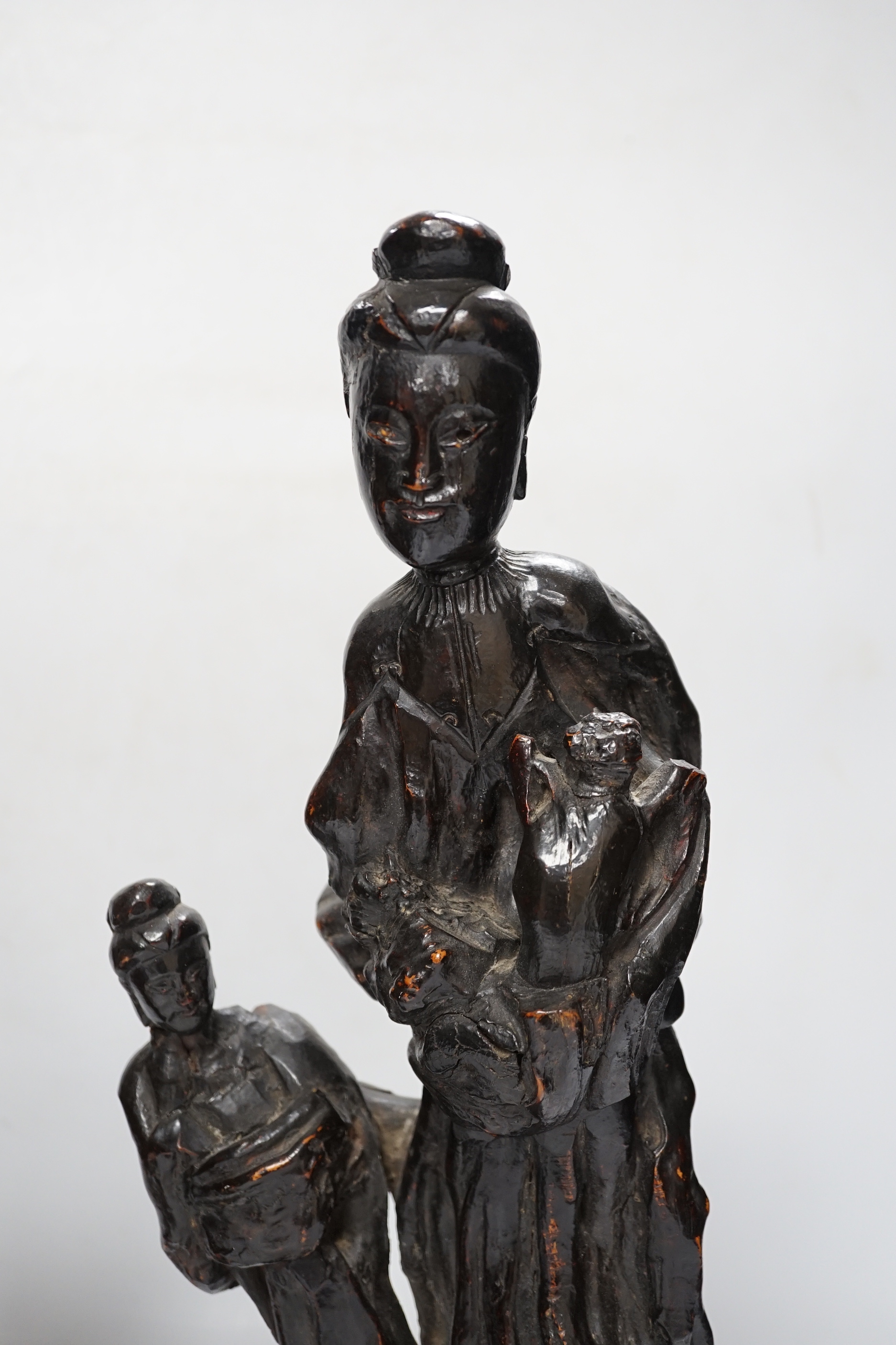 A Chinese root wood carving of two females, 42cm, and an early 20th century Chinese root carving of an immortal, on soapstone base, 36cm tall